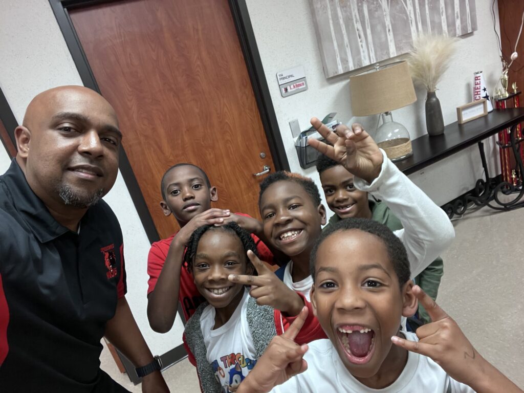 IMG_2430 Principal Johnson with students during lunch time.