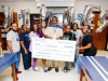 Representatives of the Kinder Foundation recognize teacher Joseph Stewart of Aldine ISD’s Plummer Middle School with the Kinder Excellence in Teaching Award.
