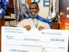 Representatives of the Kinder Foundation recognize teacher Joseph Stewart of Aldine ISD’s Plummer Middle School with the Kinder Excellence in Teaching Award.
